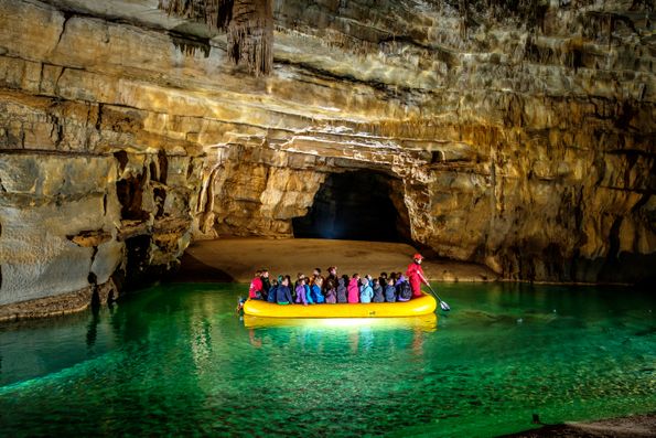 By boat across the first lake of Križna Jama